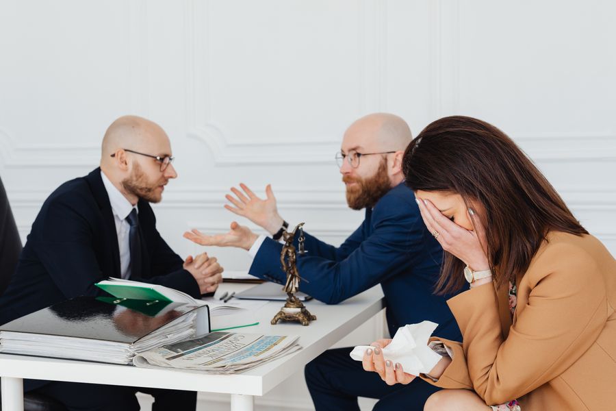 An attorney mediating a discussion in a legal office