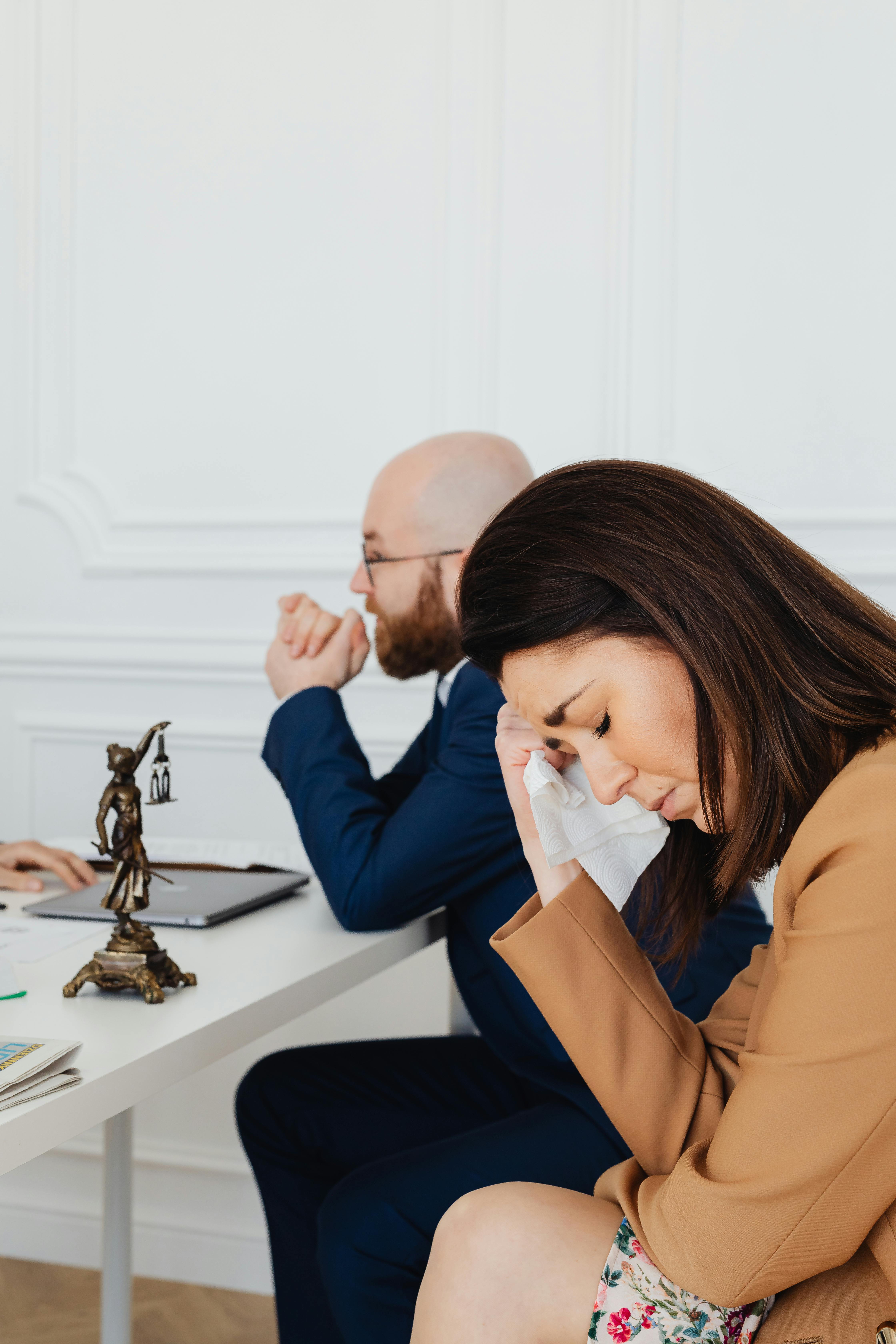 a man and a woman inside a law office