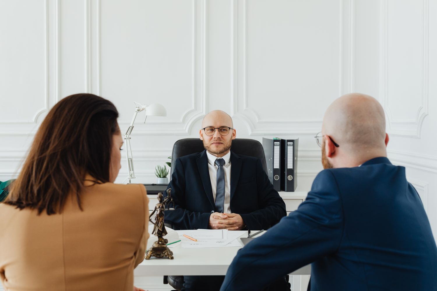 Injured clients discussing their accident claim with an attorney