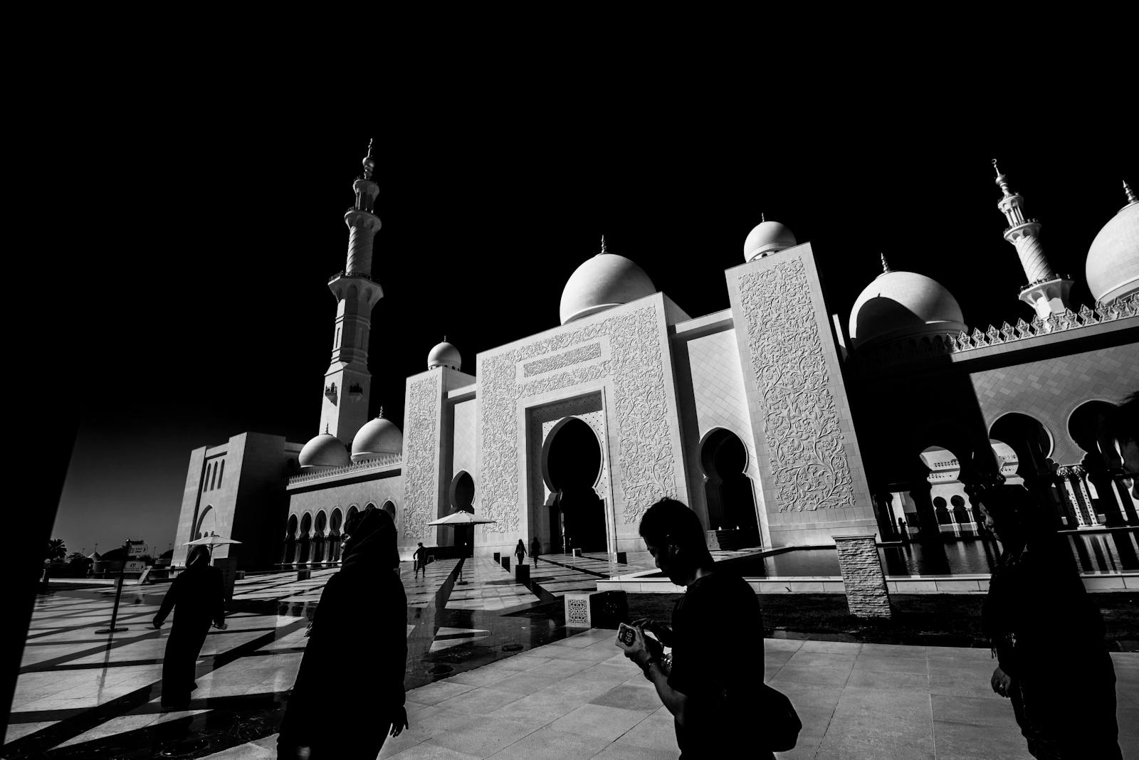 Emergency vehicles with flashing lights responding in a city street