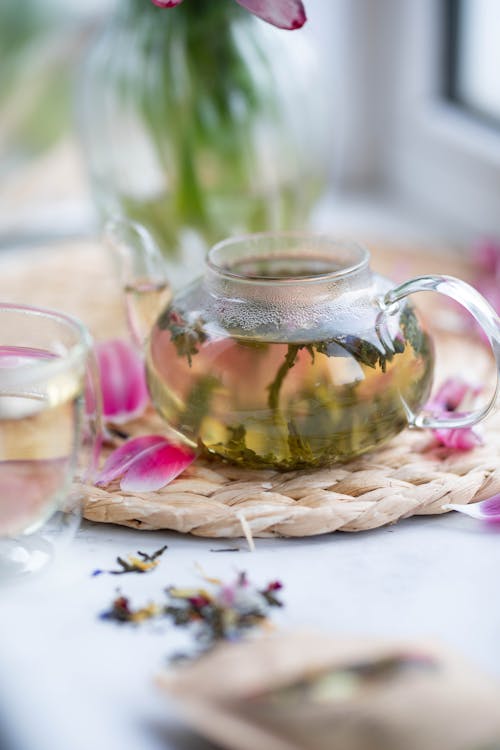 Herbal tea in transparent teapot