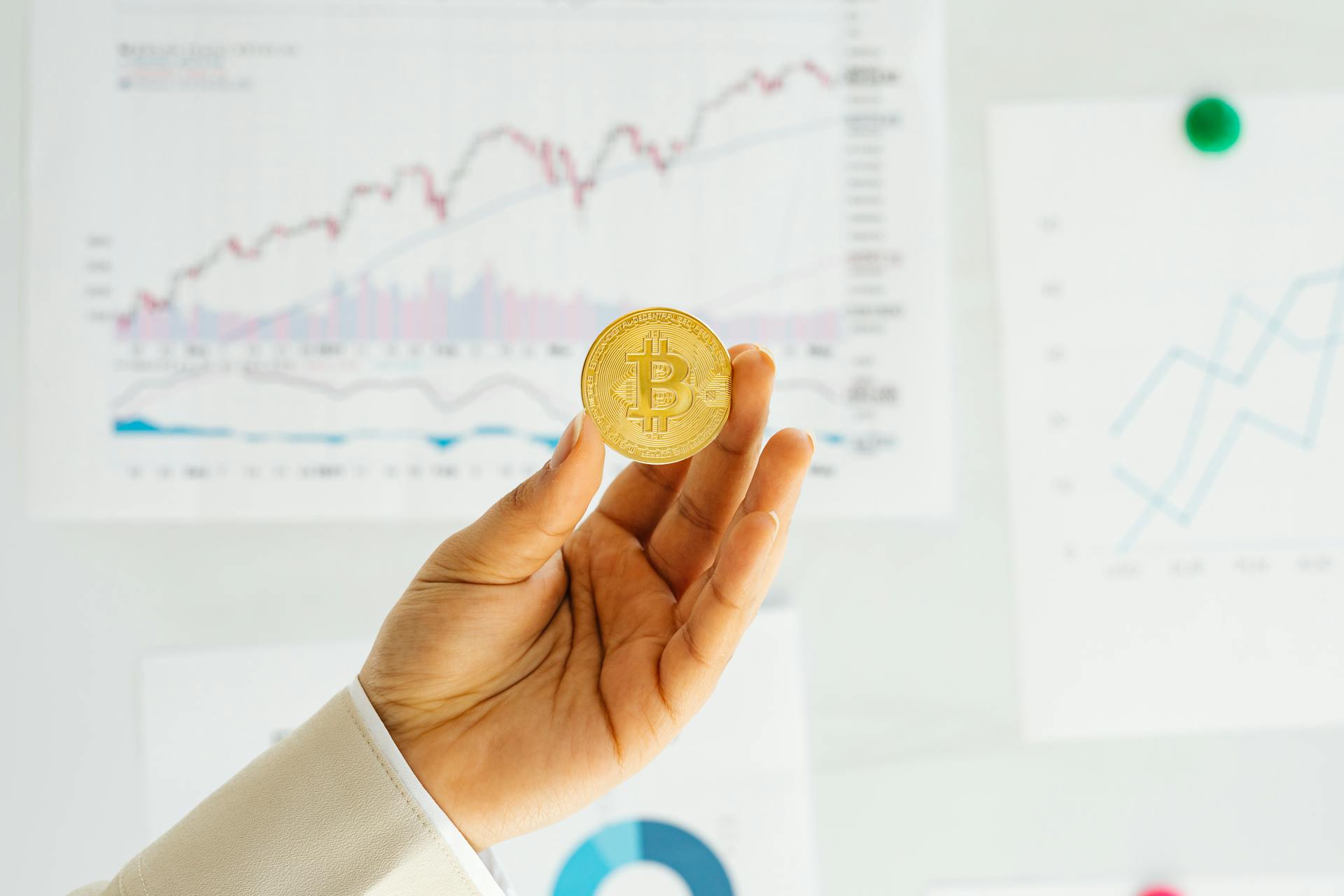 Woman Hand Holding Golden Bitcoin Coin