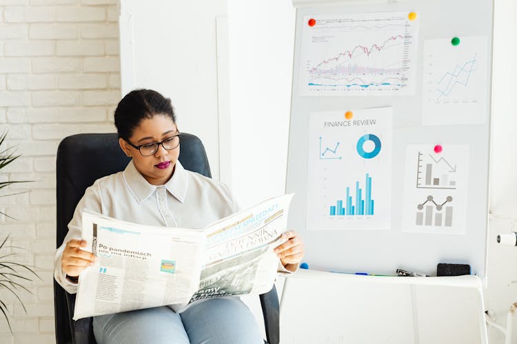 A Woman Reading Newspaper