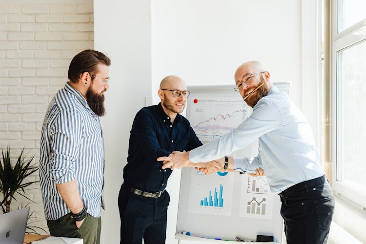 Men Shaking Hands In The Office