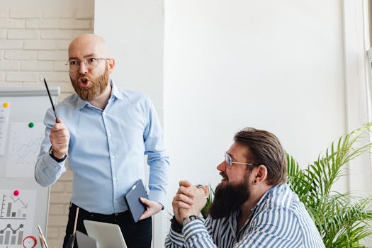 Two businessmen engaged in an energetic discussion during a presentation.