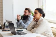 Man and Woman Sitting at the Table