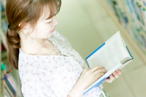 Free stock photo of bookcase, girl, reading