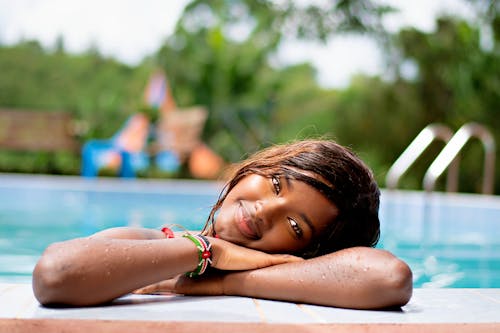 Free A Young Woman by the Poolside Stock Photo