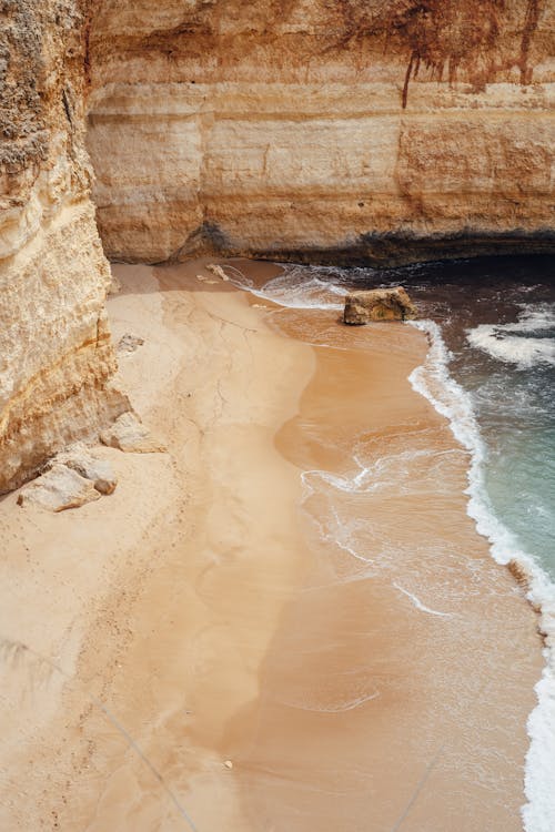 Drone Shot of a Beach with a Natural Rock Formation