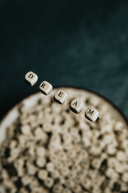 Word Dream Spelled with White Letter Cubes