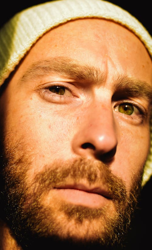 Close-Up Shot of Bearded Man Wearing Knitted Cap