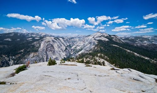 Free A breathtaking aerial view of rugged mountains under a clear blue sky, showcasing nature's splendor. Stock Photo