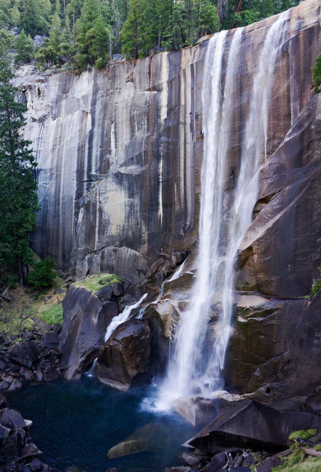 A waterfall thundering down a granite cliff
