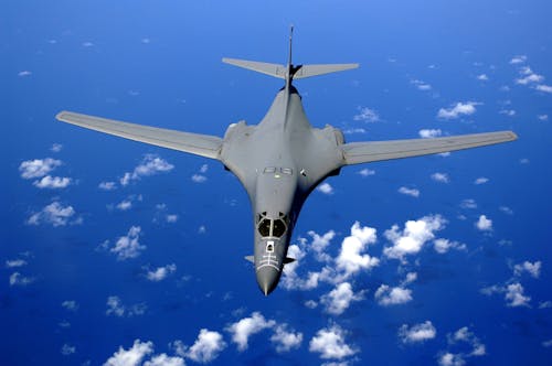 Black Fighter Jet Near White Clouds