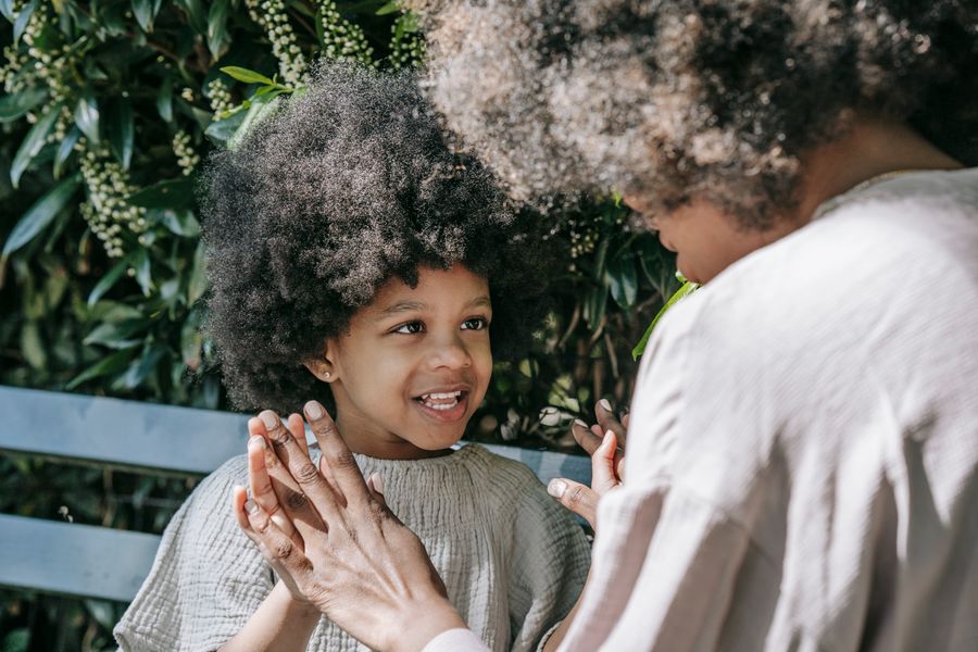 Mother and child laughing together during a bonding moment