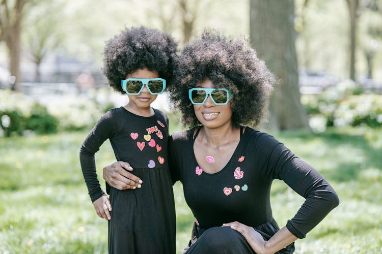 Selective Focus Of A Mother And Child Wearing Sunglasses