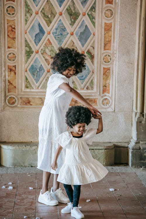 Free A Woman Dancing with her Child Stock Photo