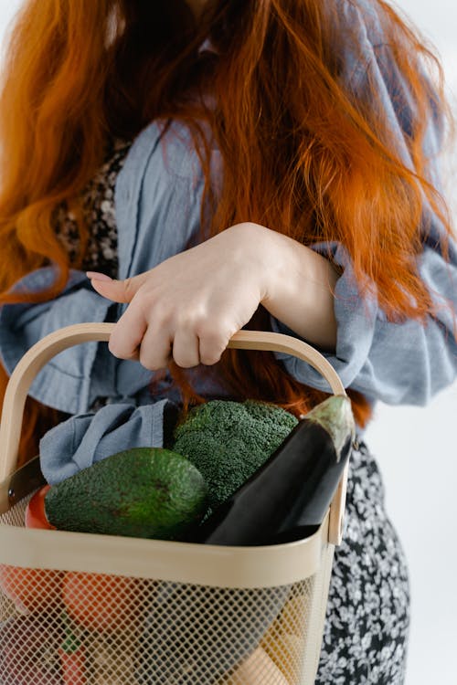 Free A Person Holding a Basket of Fruits and Vegetables Stock Photo