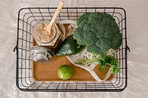 A Basket of Healthy Fresh Food and a Jar of Oatmeal