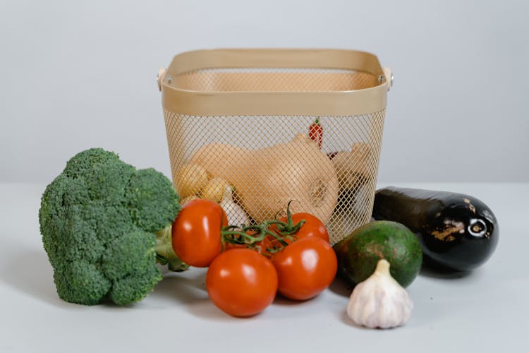 Fresh Fruits And Vegetables On White Surface