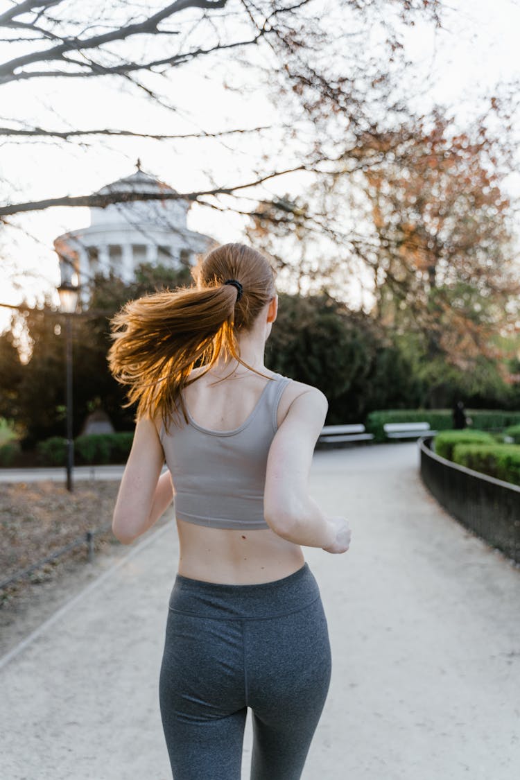 A Woman Running At The Park