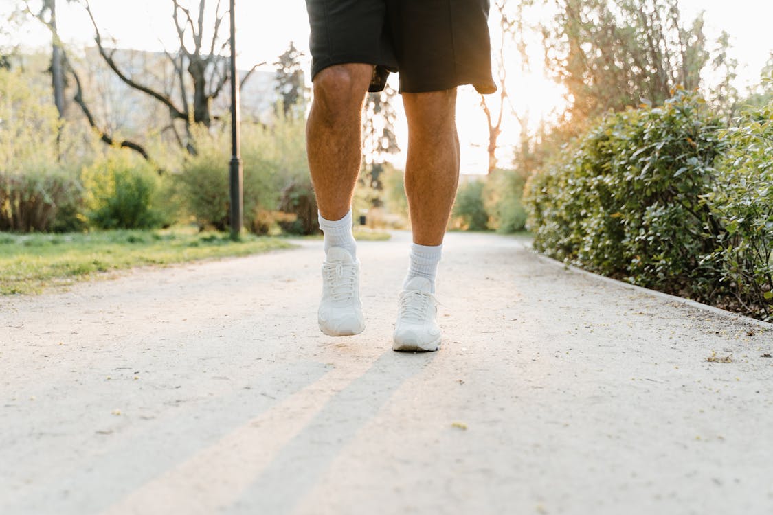 Person Wearing White Rubber Shoes · Free Stock Photo