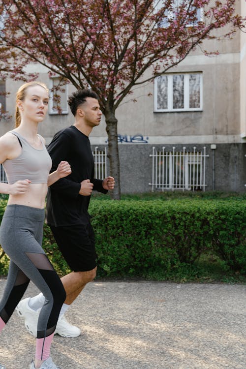 Free A Couple Jogging during the Day Stock Photo