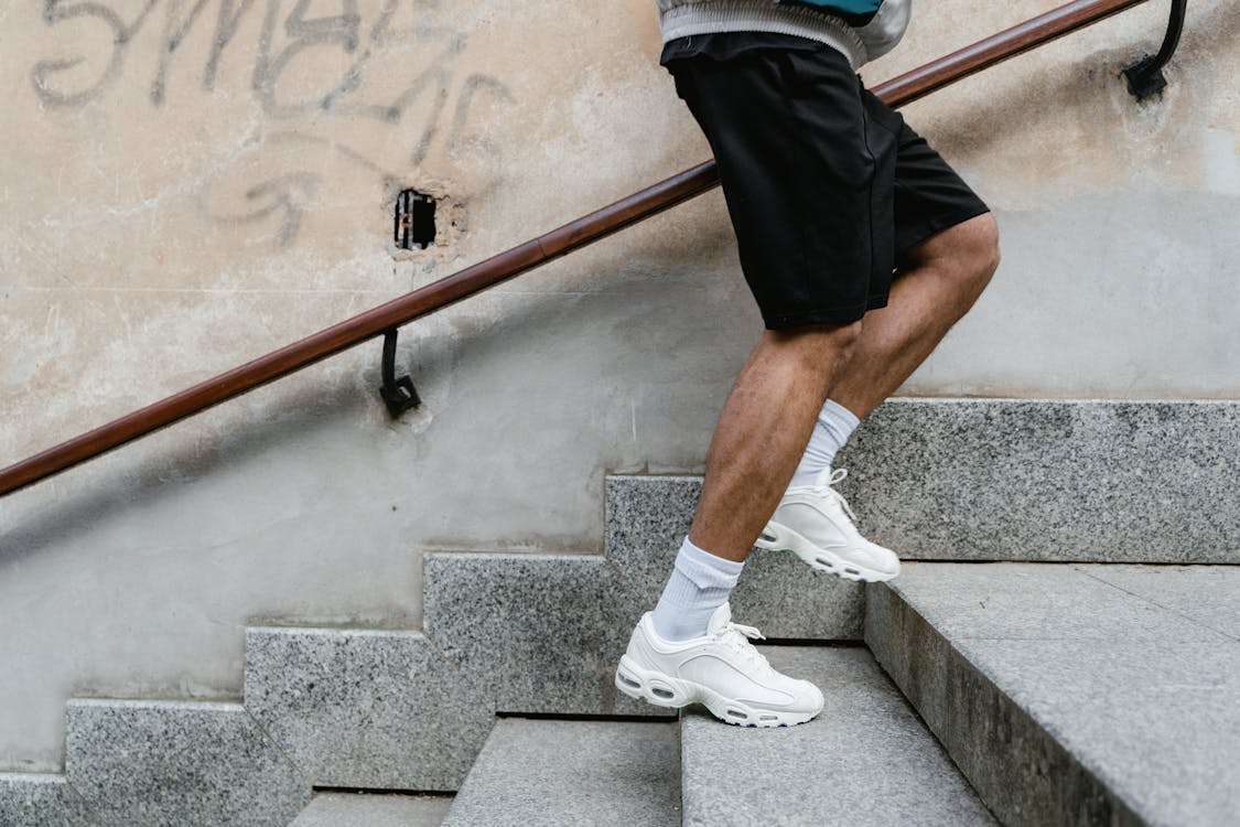 Free A Person Climbing up the Stairs Stock Photo