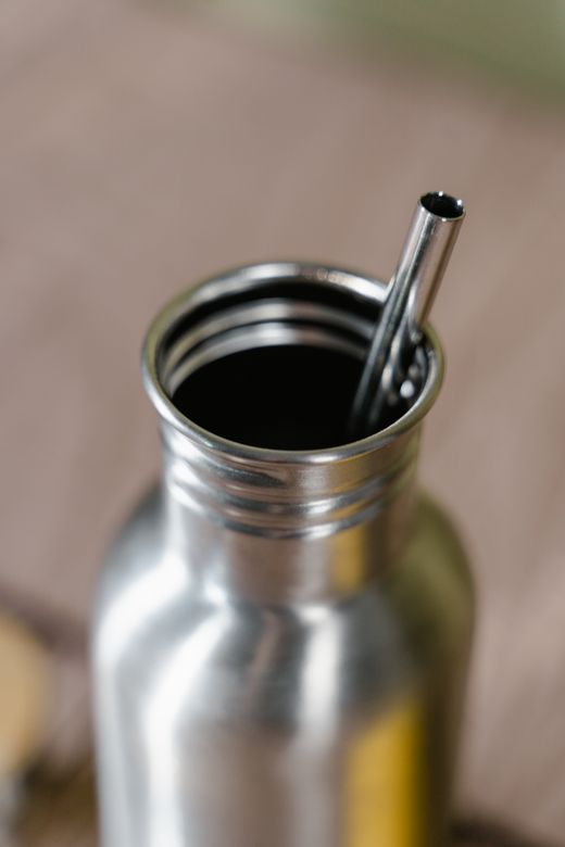 Stainless-steel tumbler with straw &mdash; photo by Tima Miroshnichenko on Pexels