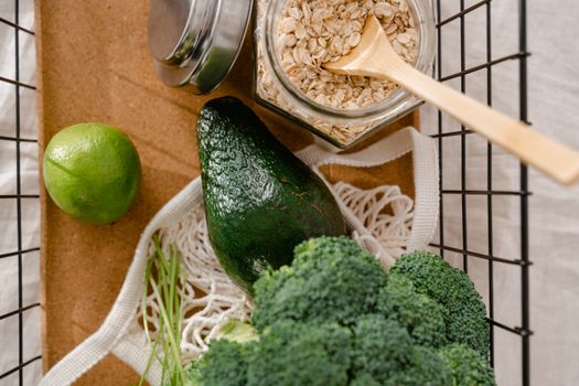 A collection of fresh ingredients including avocado, broccoli, and oats for a nutritious meal prep.