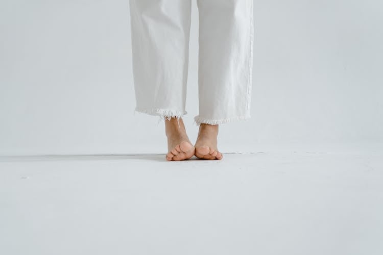 A Person In White Jeans