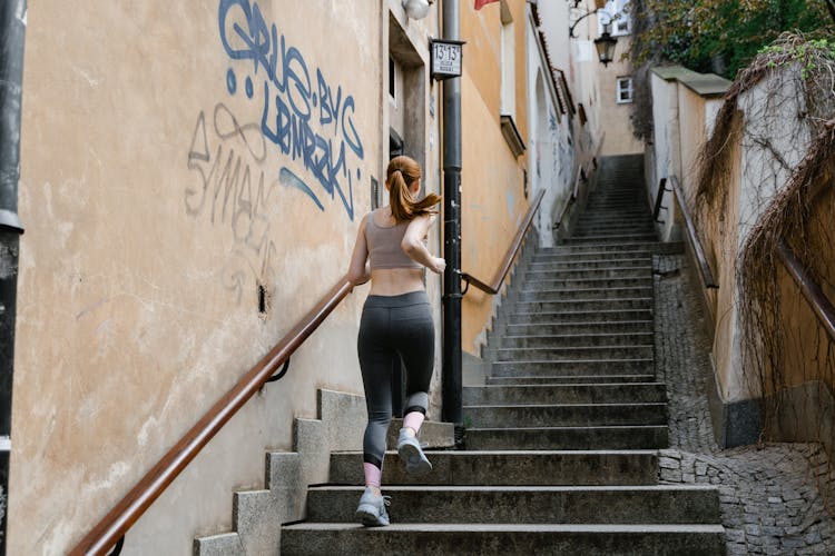 Woman Running On The Stairs