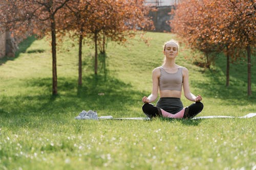 Free A Woman Doing a Yoga Exercise Stock Photo