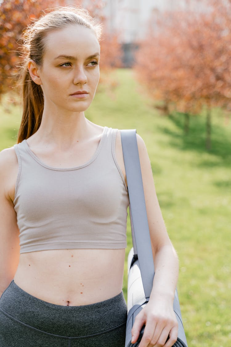 Pretty Woman Carrying A Yoga Mat