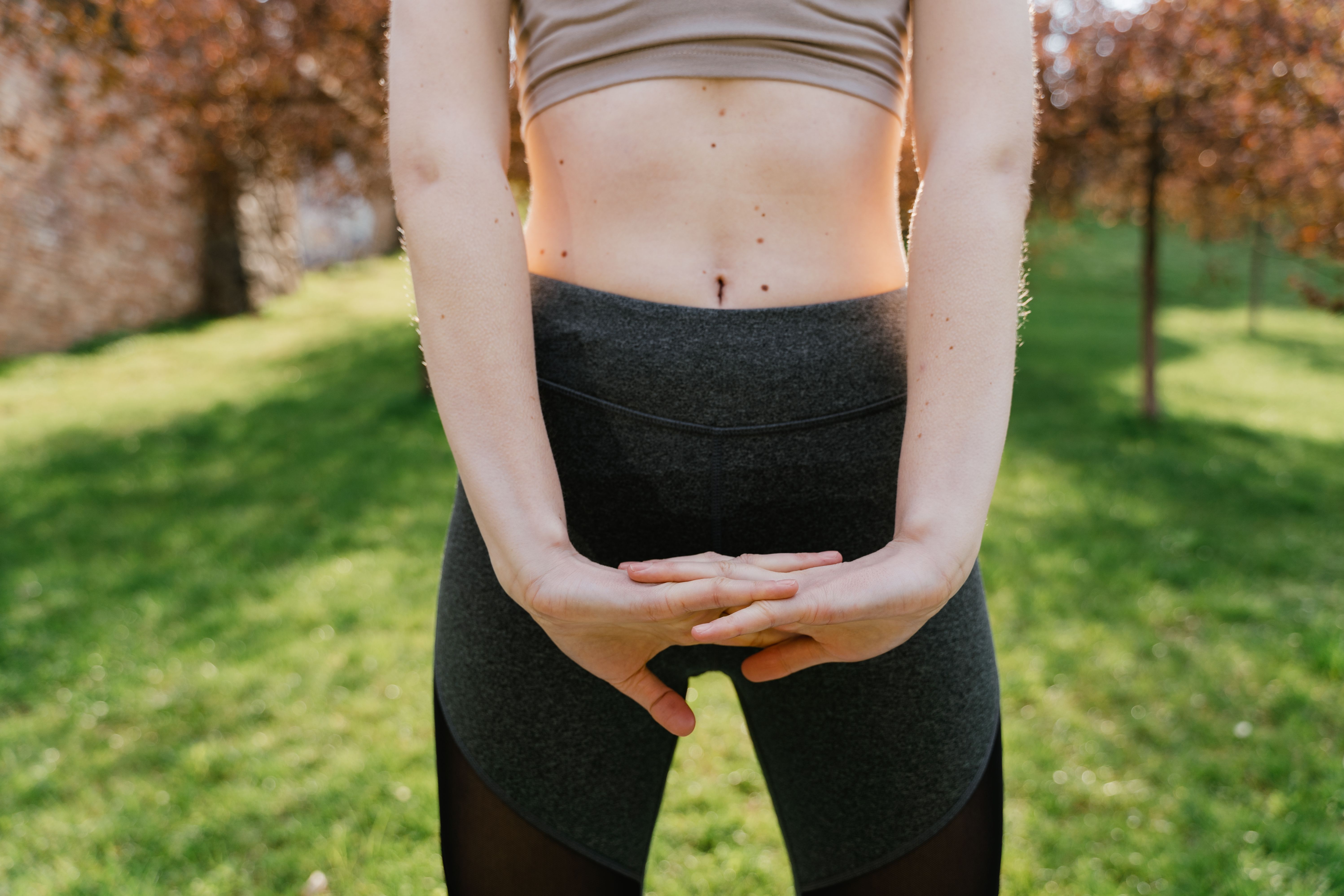 person stretching or walking in nature, highlighting body movement