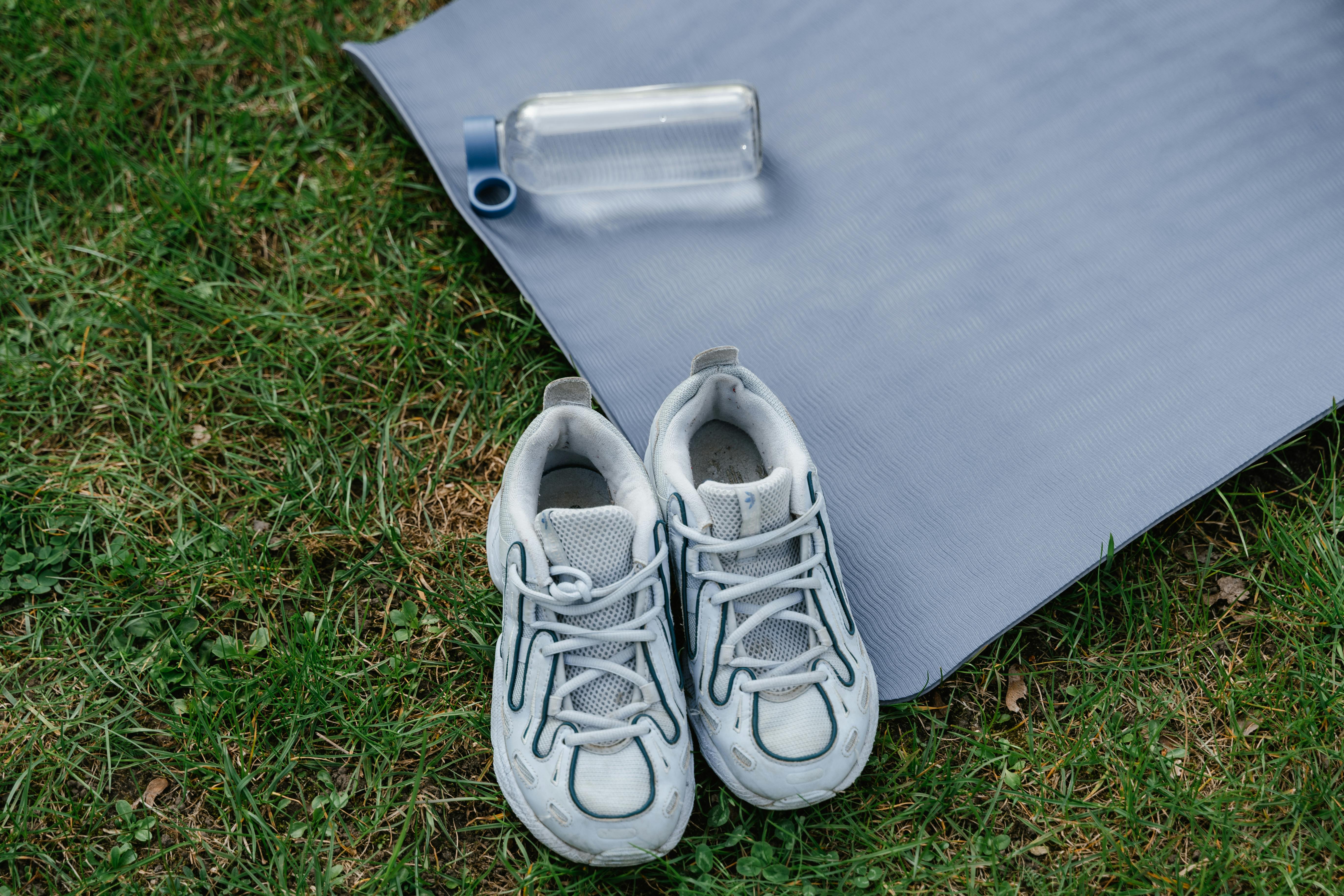 Overhead Shot of Shoes and a Yoga Mat · Free Stock Photo