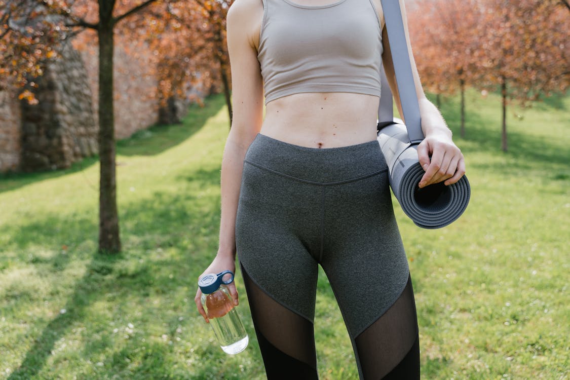 A Woman Holding Yoga Mat