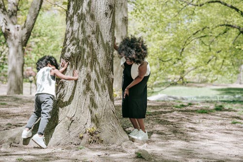 Free Mother and Child Playing Hide and Seek Stock Photo