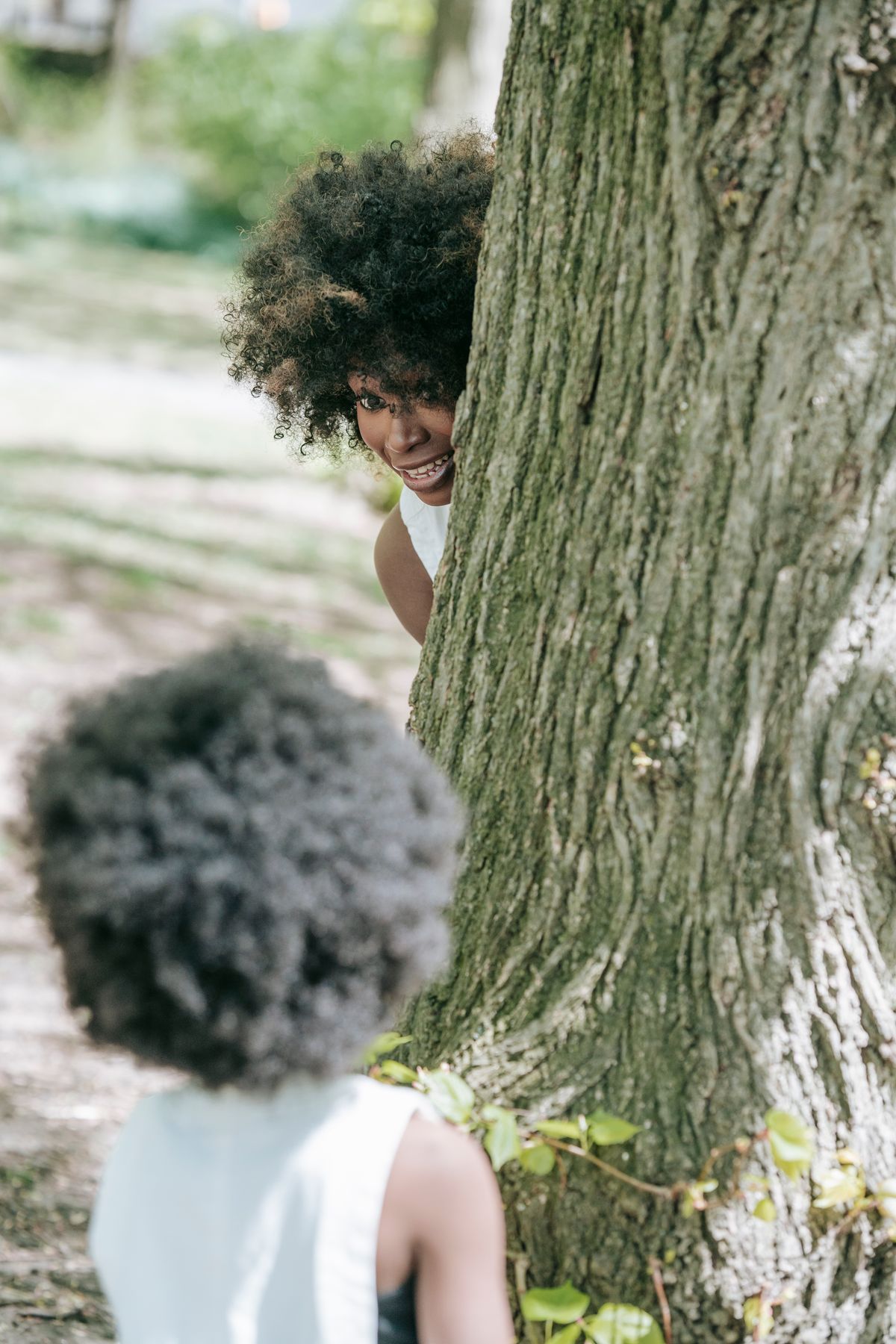 Children playing hide and seek outdoors