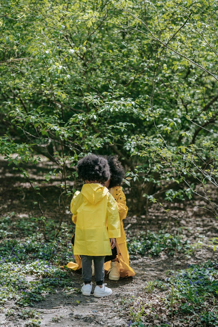 Backview Of A Kid Wearing Yellwo Raincoat 