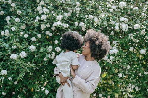 Free A Woman Carrying a Child Stock Photo