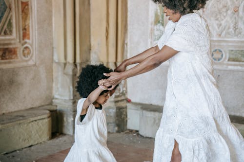 Free A Woman Dancing with her Daughter Stock Photo