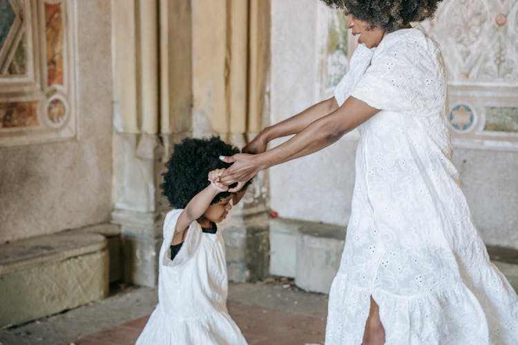 A Woman Dancing With Her Daughter