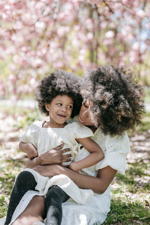 A Woman Sitting with her Daughter