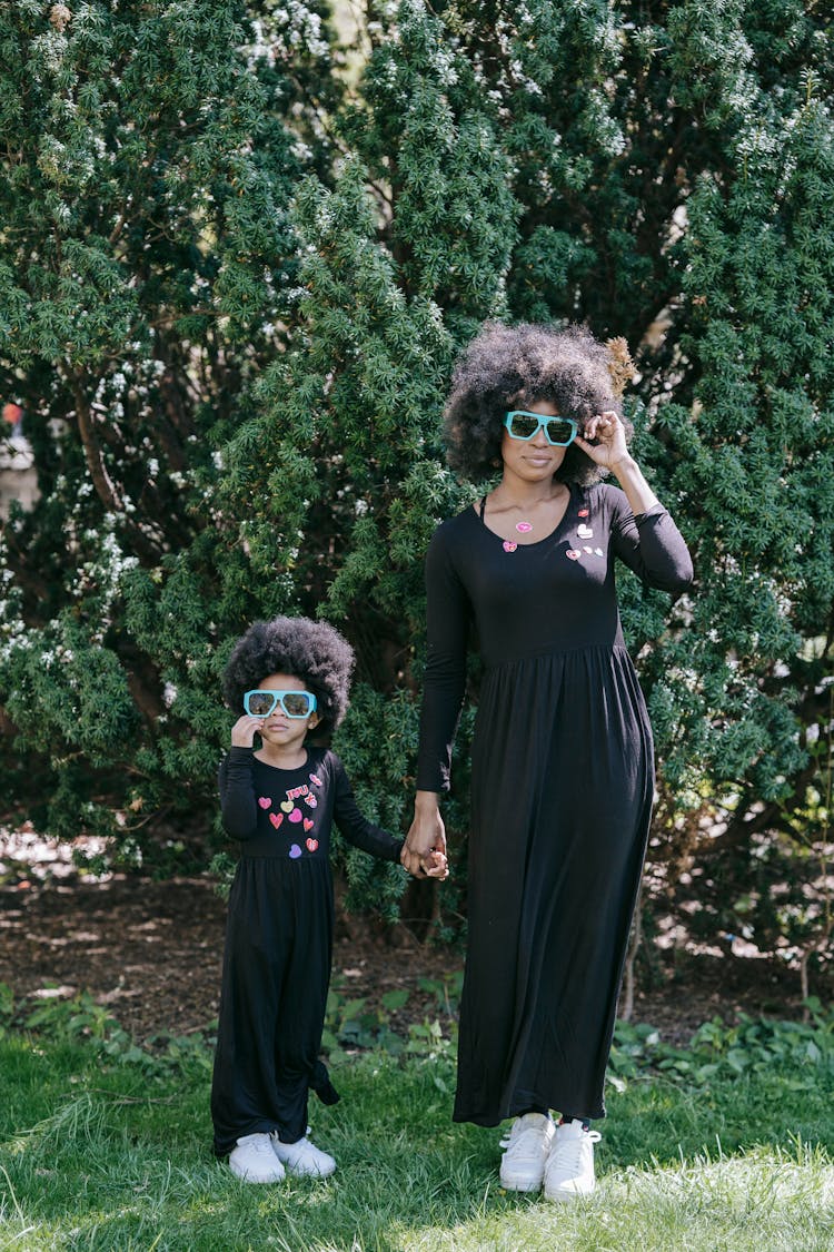 Woman And Child Wearing Black Dress In The Park