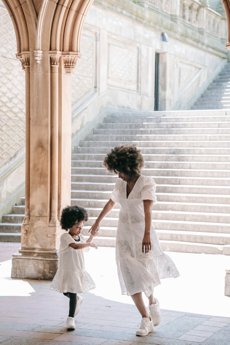 Mother With Daughter In Matching Dresses