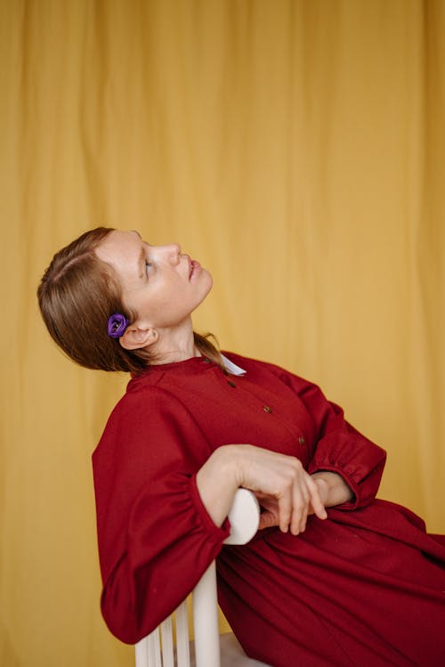 Side View of a Woman Posing in a Chair