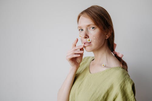 Portrait of a Woman with White Flowers on her Lips