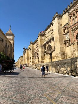 Explore the historic exterior of Córdoba's Mosque-Cathedral, a UNESCO World Heritage site.