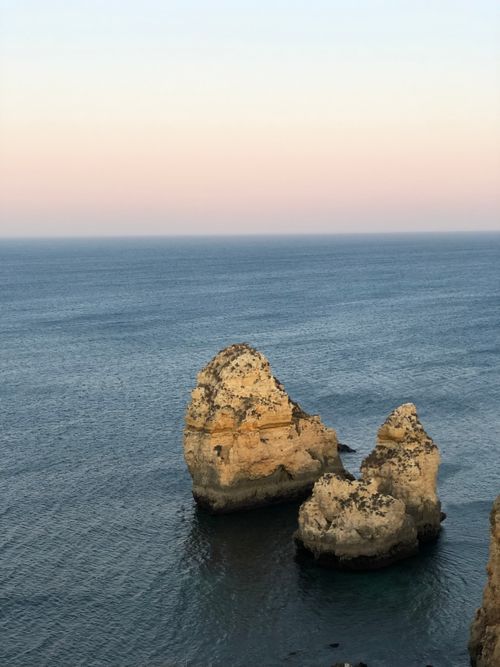 Free Scenic view of rock formations off the coast of Lagos at sunset, Portugal. Stock Photo